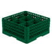 A Vollrath green plastic glass rack with nine compartments.