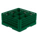 A green plastic Vollrath Traex glass rack with 9 compartments.