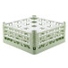 A light green plastic Vollrath glass rack with 16 compartments.