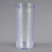 A clear Carlisle plastic tumbler with a blue rim.