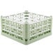 A light green Vollrath plastic glass rack with 16 compartments.