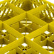 A yellow plastic Vollrath Traex glass rack with compartments and a grid pattern.
