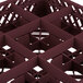 A close up of a Vollrath Traex burgundy glass rack with 9 compartments and a grid pattern.