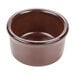 A close-up of a brown Tuxton China ramekin.