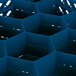 A blue plastic Vollrath Traex glass rack with compartments and a lid.
