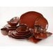 A group of brown Tuxton TuxTrendz Artisan Red Rock china plates with cups and saucers.