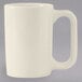 A white Tuxton Vista china mug with a handle.