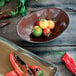 A Tuxton TuxTrendz Capistrano bowl of tomatoes and peppers on a counter.