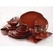 A group of Tuxton TuxTrendz Artisan Red Rock China trays, plates, bowls, and mugs on a counter.