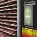 A stainless steel Excalibur dehydrator rack with meat drying.