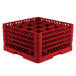 A red plastic Vollrath Traex glass rack with 16 compartments.