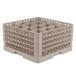 A beige plastic Vollrath Traex glass rack with 16 compartments.