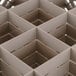 A Vollrath beige glass rack with 16 compartments.