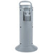 A grey plastic cylinder with a handle and a lid holding a toilet brush and swab.