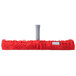 An Unger red SmartColor StripWasher with a grey plastic T-Bar pole.
