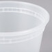 A close-up of a Pactiv translucent plastic deli container with a lid.