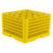 A yellow Vollrath Traex glass rack with 16 compartments.