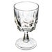 An Arcoroc clear glass wine glass with a faceted design.