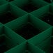 A green plastic grid with squares and holes.
