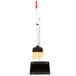 An Unger Ergo angled lobby broom and dustpan with a handle.