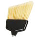 A black and white broom with a white handle.