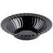 A black Fineline Flairware plastic bowl with scalloped edges.