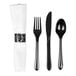 A pre-rolled white napkin with a silver swirl ring and a set of black plastic fork, knife, and spoon.