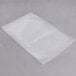 A clear plastic ARY VacMaster vacuum packaging bag on a grey surface.