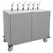 A grey metal Lakeside serving cart with six pumps on it.