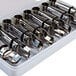 A white plastic case holding Ateco stainless steel cake and pastry decorating tools.