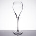 An Arcoroc Malea flute wine glass on a table.