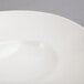 A close-up of a 10 Strawberry Street Whittier white shallow oval bowl.