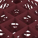 A Vollrath Traex burgundy plastic glass rack with 16 compartments for glasses.