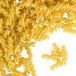 A pile of Regal Rotini Pasta on a white background.