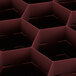 A pink plastic Vollrath Traex glass rack with hexagonal compartments.
