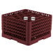 A burgundy plastic Vollrath Traex glass rack with glasses inside.