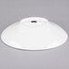 A white 10 Strawberry Street Whittier shallow oval porcelain bowl on a gray surface.