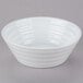 A white 10 Strawberry Street Swing porcelain cereal bowl with a spiral design.