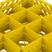 A yellow Vollrath Traex glass rack with 16 compartments.