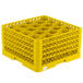 A yellow plastic Vollrath Traex rack with 20 compartments for holding glasses.