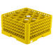 A yellow Vollrath Traex glass rack with a grid for 20 glasses.