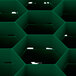 A green Vollrath Traex rack with hexagon compartments.