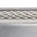 A close-up of a metal surface with a silver Edlund 1/4" blade assembly.