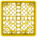 A yellow Vollrath Traex rack with 20 square compartments.