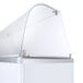A clear curved glass shield on a white surface.