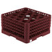 A Vollrath Traex burgundy glass rack with 20 compartments.