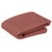 A stack of folded mauve Intedge square table covers.