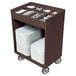 A dark brown Cambro tray and silverware cart with white plates and utensils.