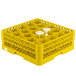 A yellow Vollrath Traex rack with compartments for glasses.