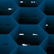 A blue plastic Vollrath glass rack with hexagons.